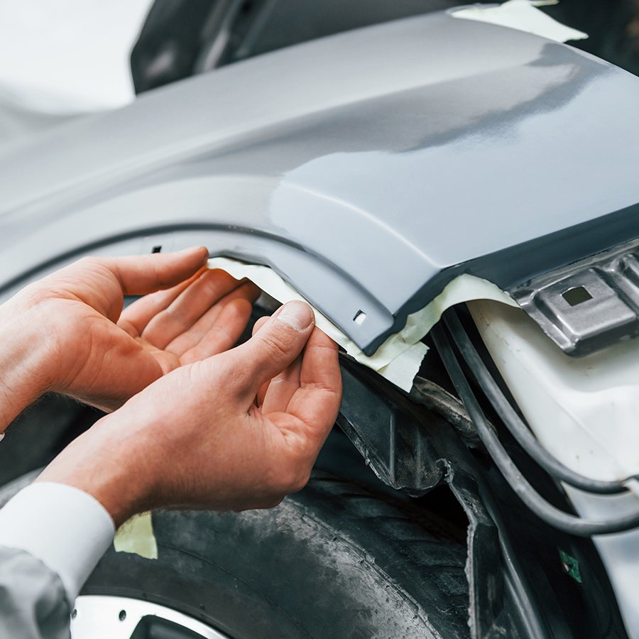 Checking panel alignment on a primed fender